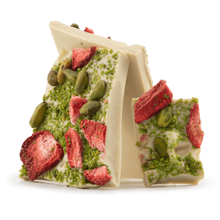 White chocolate broken bars with strawberries and pistachios